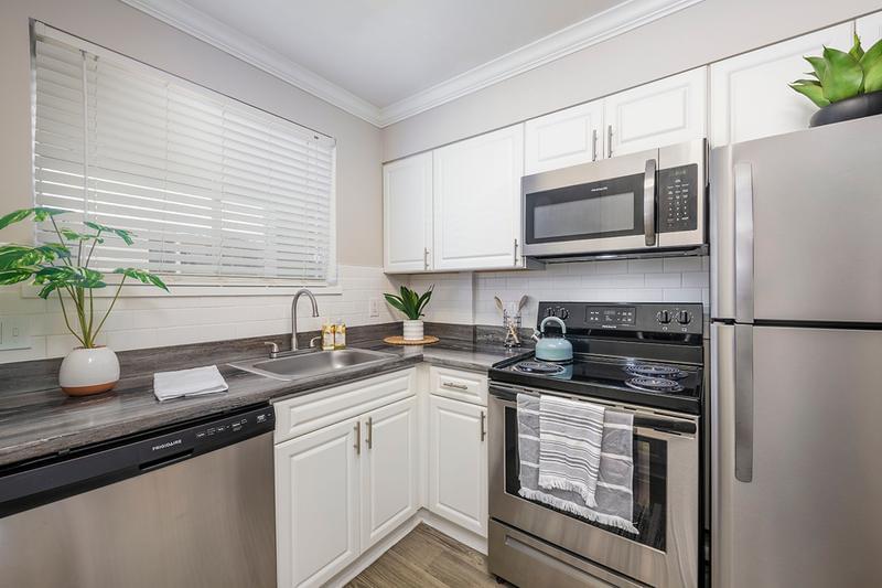 Stainless Steel Appliances | Newly remodeled kitchens with white cabinetry, and stainless steel appliances.