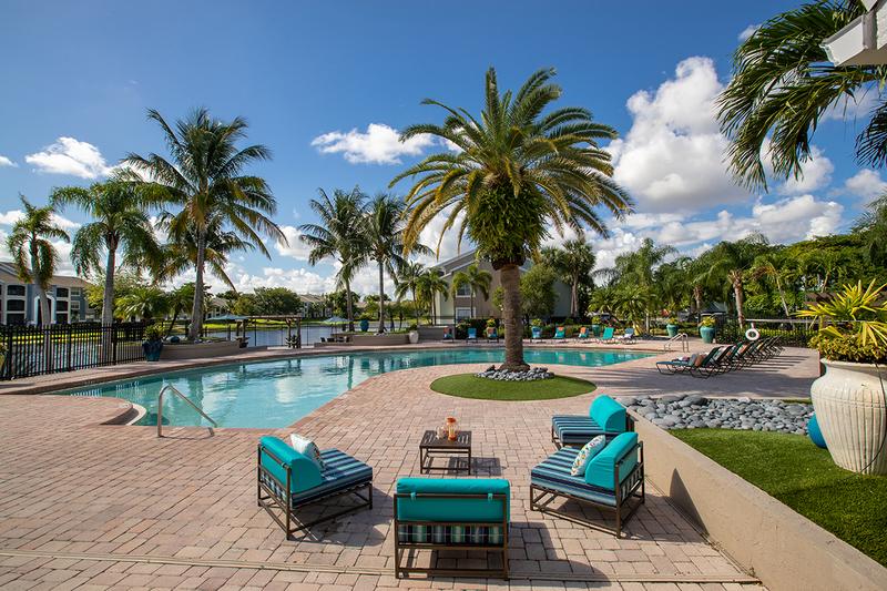 Poolside Tables | Sit out next to the pool at one of our poolside tables.