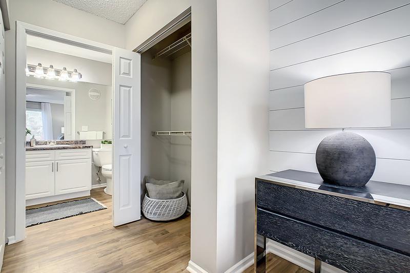 Master Bathroom and Walk-Through Closet | Master bedrooms feature a walk-through closet that leads to your private bathroom featuring a garden tub, large mirrors, and a closet with built-in organizers.