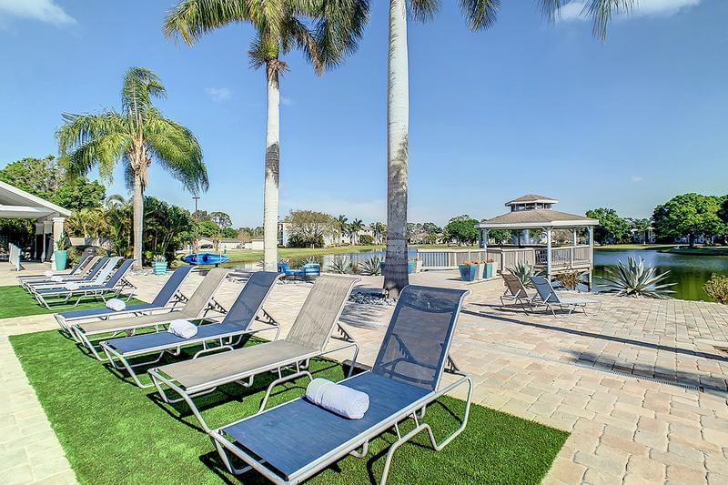 Poolside Loungers | Enjoy soaking in the sun and taking in lakeside views by the pool.