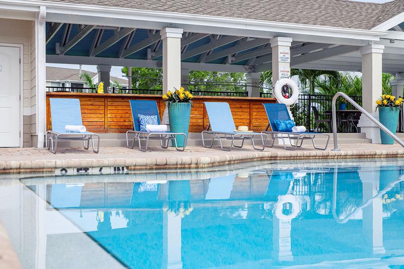 Poolside Loungers | Enjoy reading a book by the pool on one of our poolside loungers.