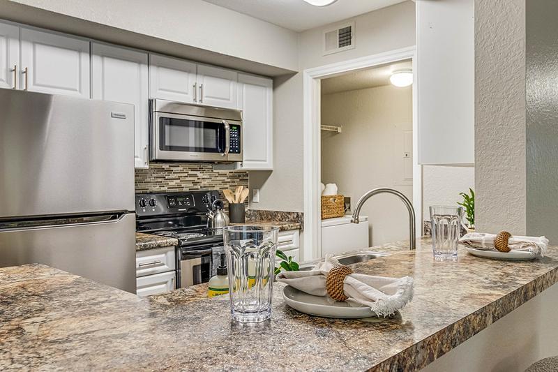 Kitchen with Breakfast Bar | Contemporary kitchens with breakfast bars, ideal for casual dining or entertaining. Laundry room is located next to the kitchen.