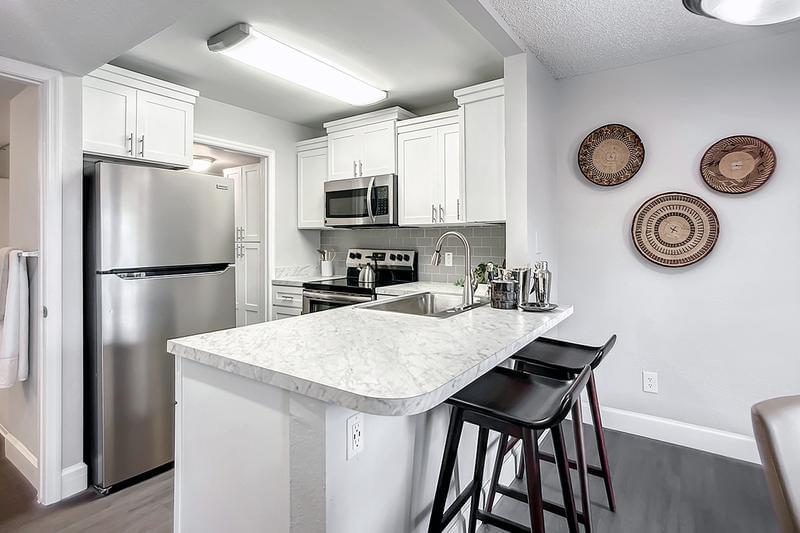 Gourmet Kitchens | Our newly renovated homes feature gourmet kitchens with a breakfast bar.