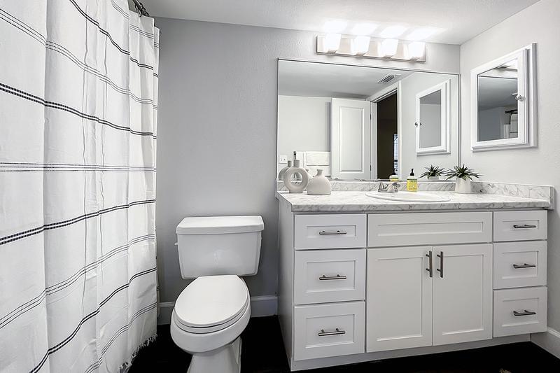 Newly Renovated Bathrooms | Bathrooms feature new cabinetry, flooring and modern counters.