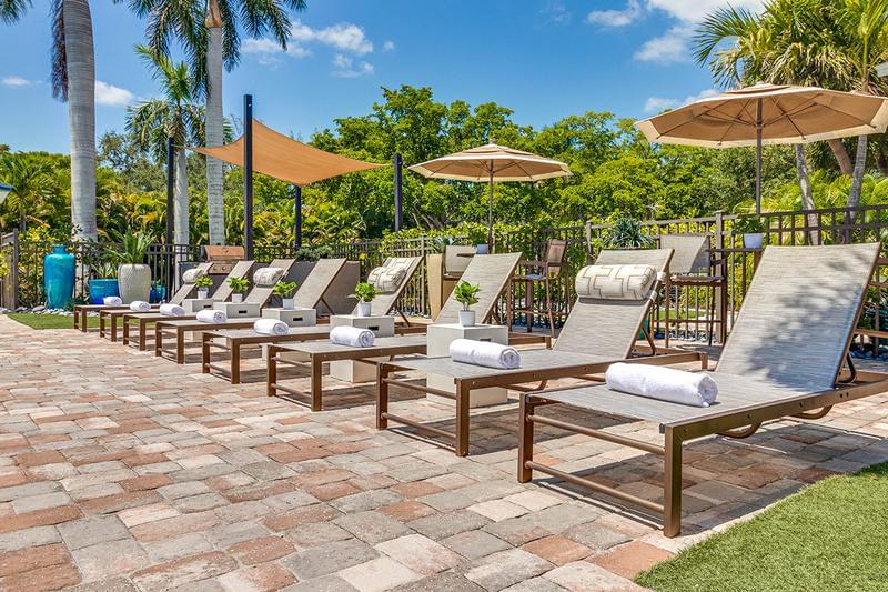 Poolside Loungers | Relax by the pool and soak in the sun from one of our loungers.
