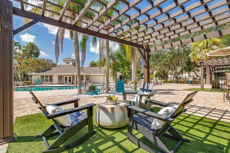 Poolside Pergolas | Relax in the shade under one of our poolside pergolas.