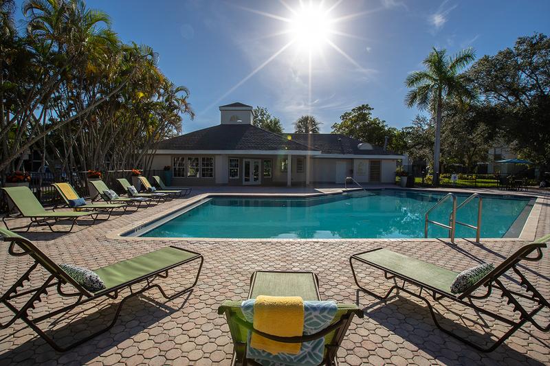 Lakeside Pool & Loungers | Relax by the pool in one of our loungers and enjoy beautiful Naples lake views.