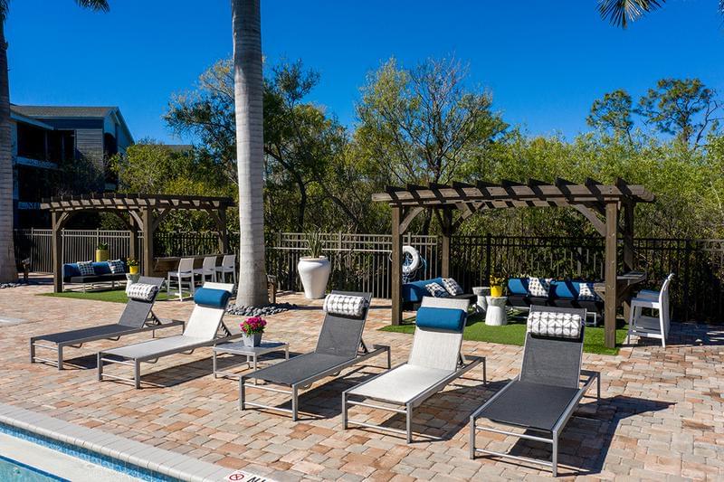 Poolside Loungers | Read a book by the pool on our sundeck, complete with plenty of poolside loungers.