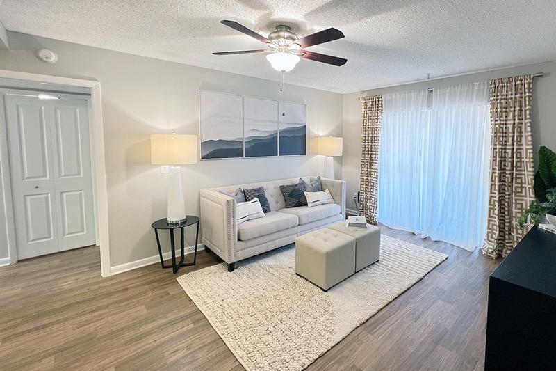 Spacious Living Room | Perfectly spacious and modern living room with a contemporary ceiling fan you will enjoy.