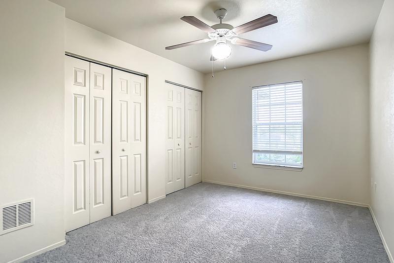 Bedroom | Bedrooms featuring plush carpeting, multi-speed ceiling fans, and spacious closets.