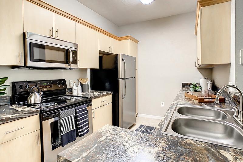Premium Kitchen | Premium kitchens feature tiled flooring, ample cabinet space, and stainless-steel appliances.