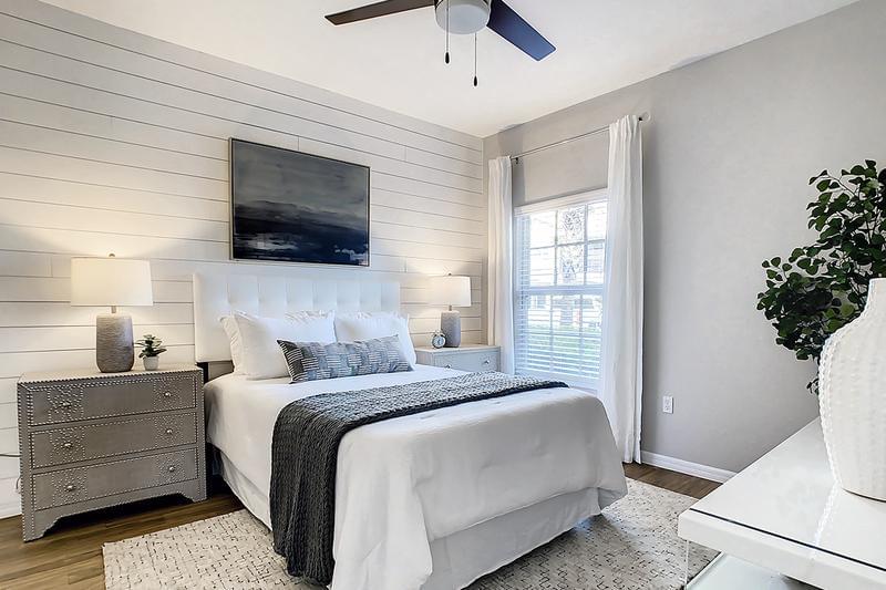 Guest Bedroom | Spacious bedrooms featuring large windows and plush, neutral carpeting, and ample closet space. 