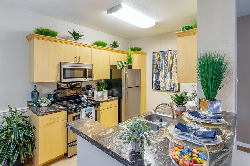 Premium Kitchen | Premium kitchens feature tiled flooring,  ample cabinet space, and stainless steel appliances.