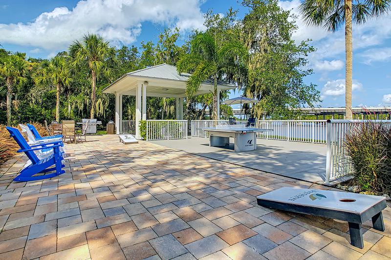 Enjoy Your Outdoor Lifestyle at The Preserve | Play a game of cornhole overlooking the lake.