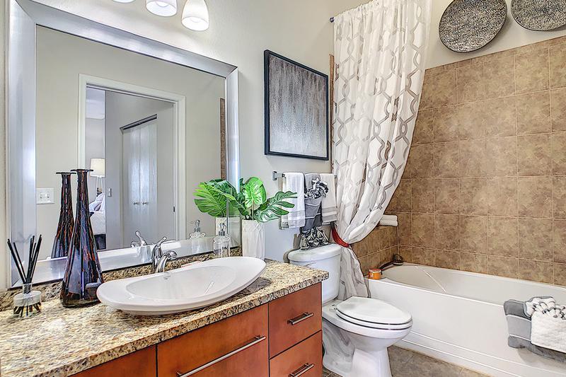 Bathroom | Updated bathrooms featuring large mirrors.