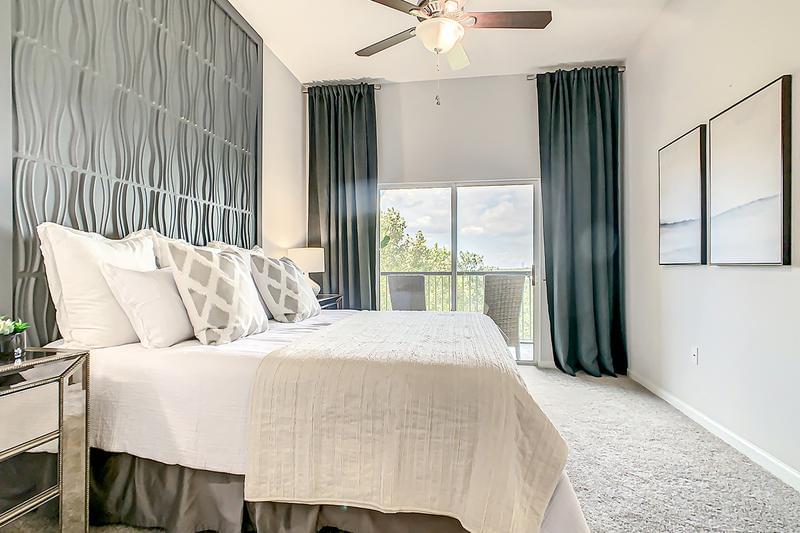 Master Suite with Patio Access | Master bedrooms featuring walk-in closets and sliders to private balcony/patio.