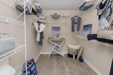 Walk-In Closets | Master bedrooms featuring walk-in closets with built-in organizers.
