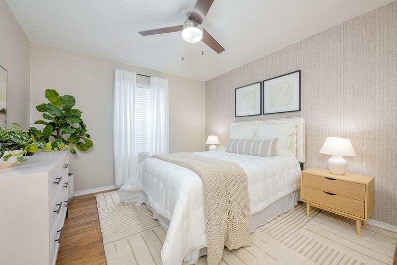 Master Bedroom | Master bedrooms feature a multi-speed ceiling fan, wood-style flooring, spacious walk-in closets, and an ensuite bathroom.