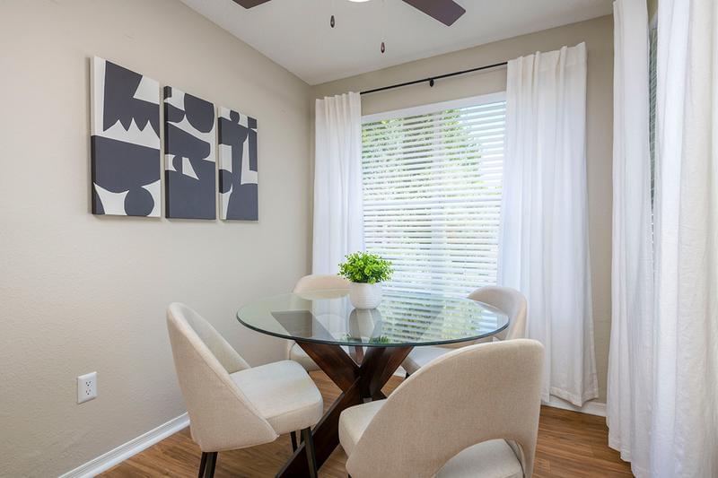 Dining Area | Spacious living room area featuring a solarium, which is the perfect space for a dining room table.
