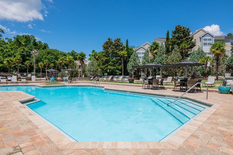Resort Style Swimming Pool | Sparkling resort-style swimming pool with expansive sundeck featuring plenty of loungers for you to take in the Florida sun!