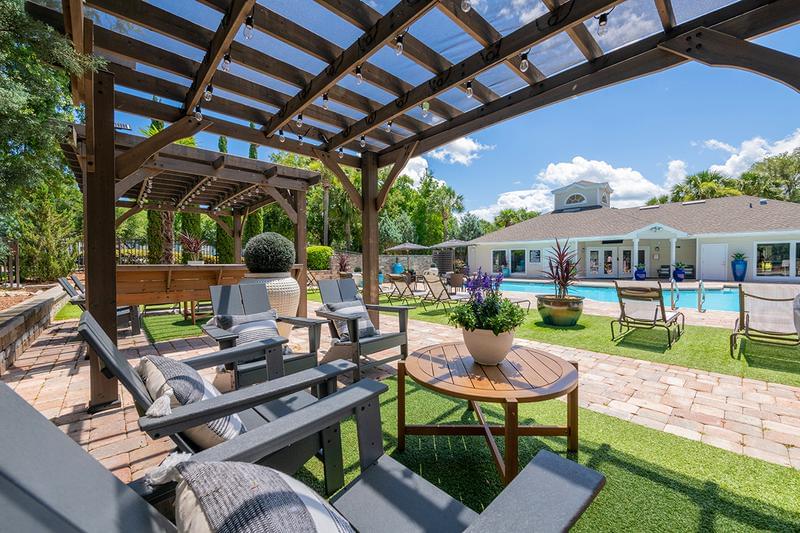 Poolside Pergola | Relax in the shade under our poolside pergolas while overlooking the pool.