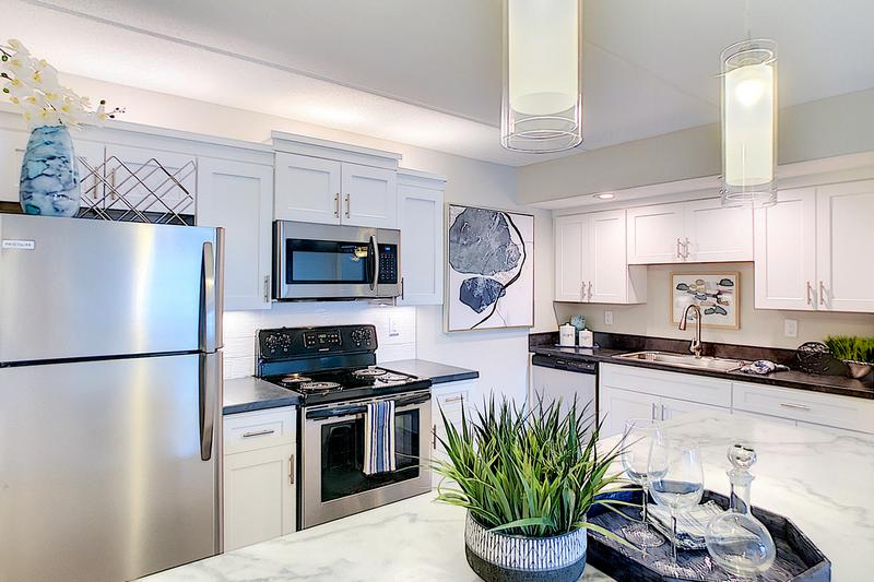 Newly Renovated Kitchens | Newly renovated kitchens featuring marble-style counter tops, and stainless steel appliances.