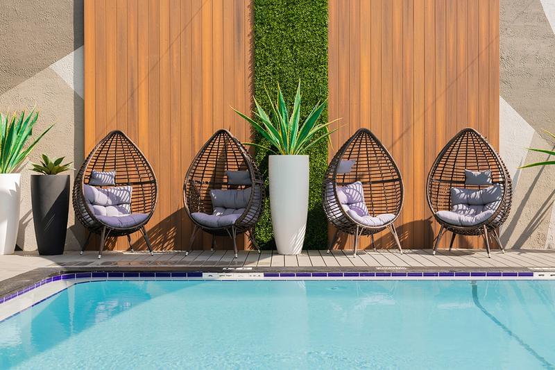 Poolside Seating | Sit back in one of our comfortable chairs while watching the kids play in the pool.
