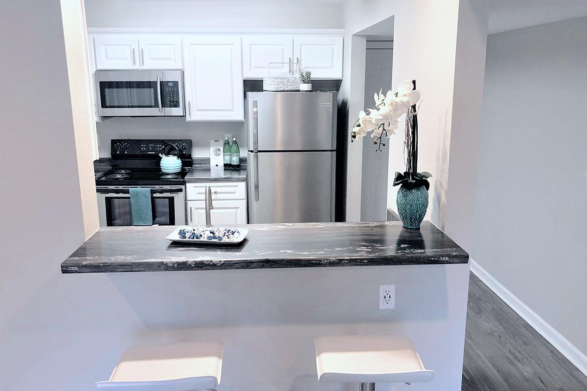 Kitchens feature a breakfast bar overlooking the living area.