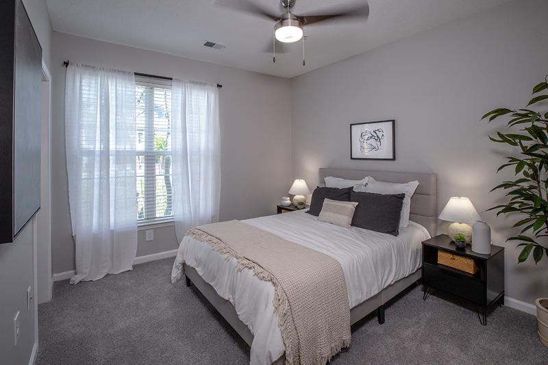 Guest Bedroom | Roommate style floor plans provide spacious bedrooms for everyone, complete with walk-in closets and large windows.