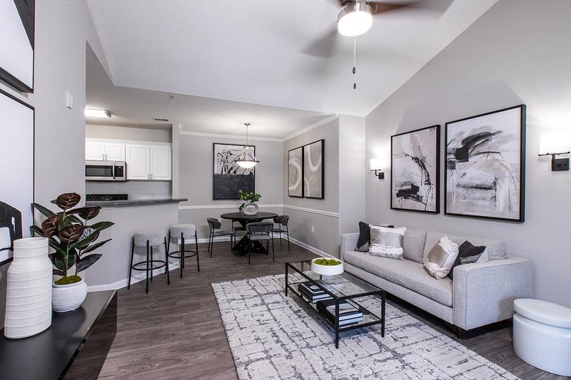 Spacious Open Floor Plans | We have open concept floor plans with a breakfast bar and a separate dining area featuring contemporary lighting.