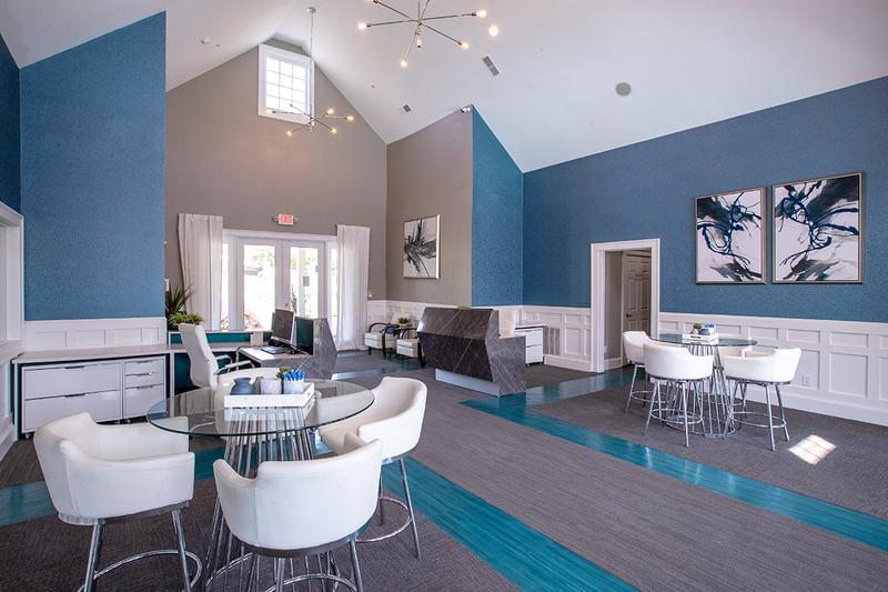 Clubhouse Seating Amazing Upgrades Coming Spring 2023! | Come have a seat in the clubhouse and enjoy a fresh cup of coffee while overlooking the pool.