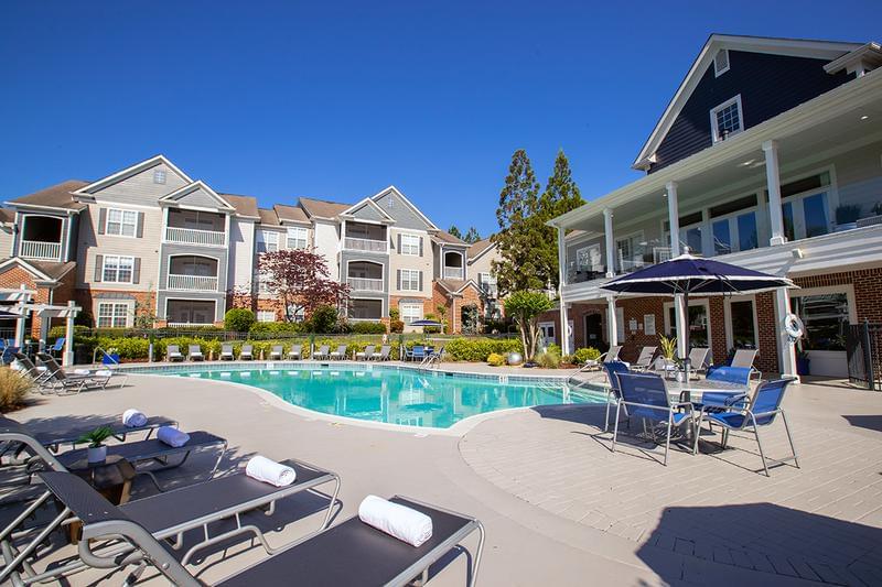 Expansive Sundeck | Relax at our expansive sundeck featuring plenty of poolside seating.