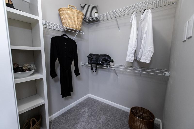 Walk-In Closet | We have custom built shelving in our oversized walk-in closets for every bedroom!