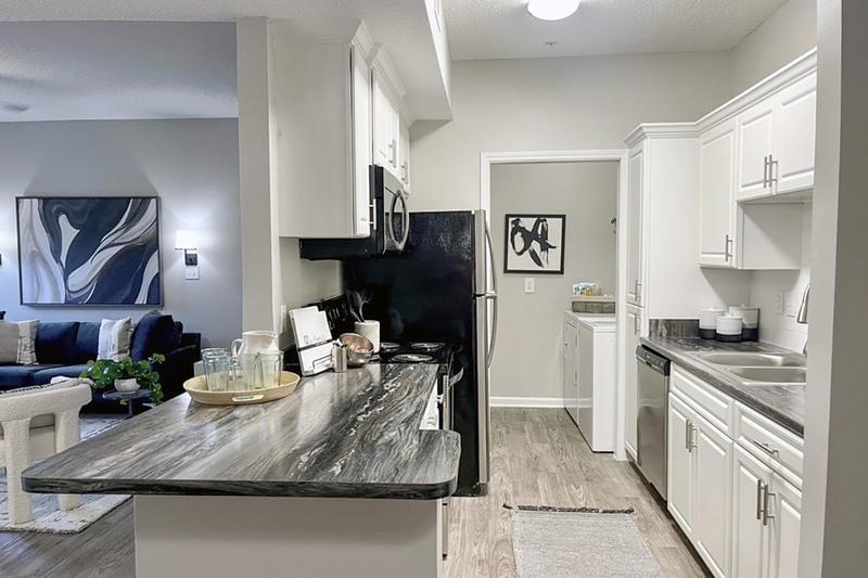 Renovated Kitchen with Breakfast Bar | Kitchens feature a large island overlooking the dining and living areas.