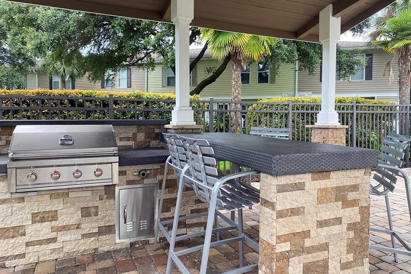 Outdoor Kitchen | Residents have access to our gas grill located on the pool deck. 