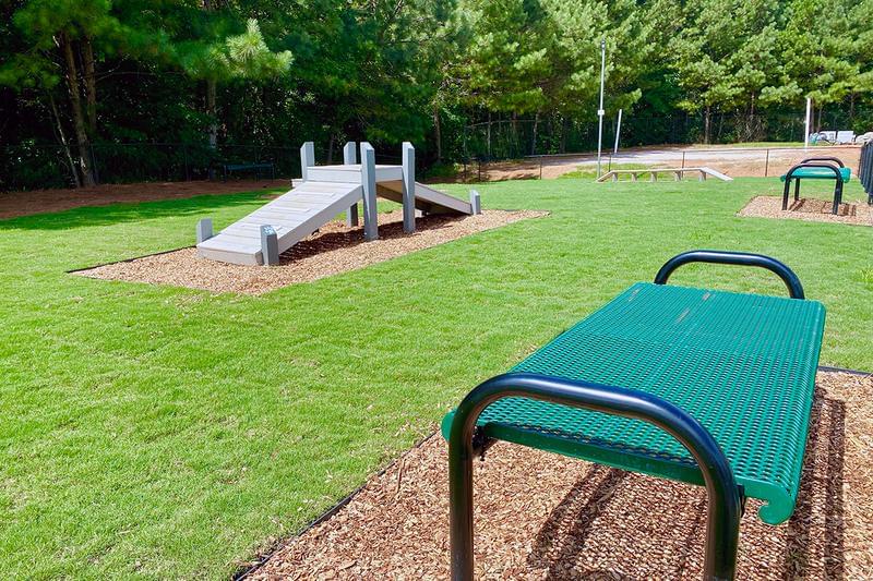 Dog Park | Have a seat while you like your pup run free in our bark park.
