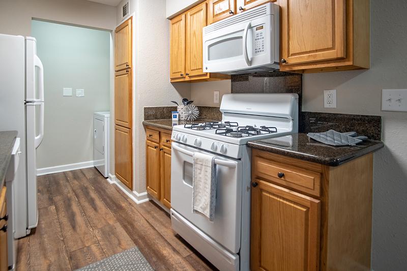 Classic Kitchen | Classic galley-style kitchen complete with all appliances, a mounted microwave, and a large pantry!

*Market rate apartments start at $1,285!
*Income restricted apartments start at $1,235!