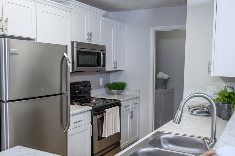 Renovated Kitchen - Limited Availability!  | At MAV at North Macon, we have limited availability for renovated apartments! Renovated kitchens feature carrara counter tops, white shaker cabinets, and stainless steel appliances!

*Renovated apartments start as low as $1,285!