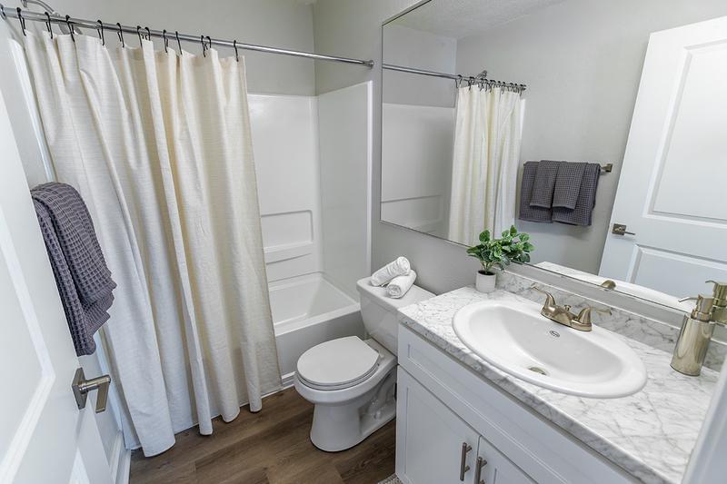 Renovated Bathroom | Complete with shaker cabinets and Carrara counters, each bathroom has a modern design!