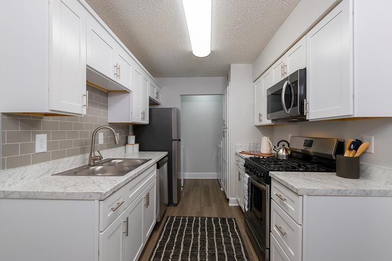 Signature Kitchen - Limited Availability! | At MAV at North Macon, we have limited availability of our signature floorplans!  Renovated kitchens feature Carrara counter tops, white shaker cabinets, and stainless-steel appliances!