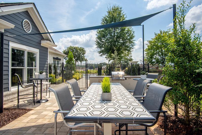 Outdoor Kitchen & Grilling Area | Have a cookout at our outdoor kitchen featuring a gas grill for resident use. 