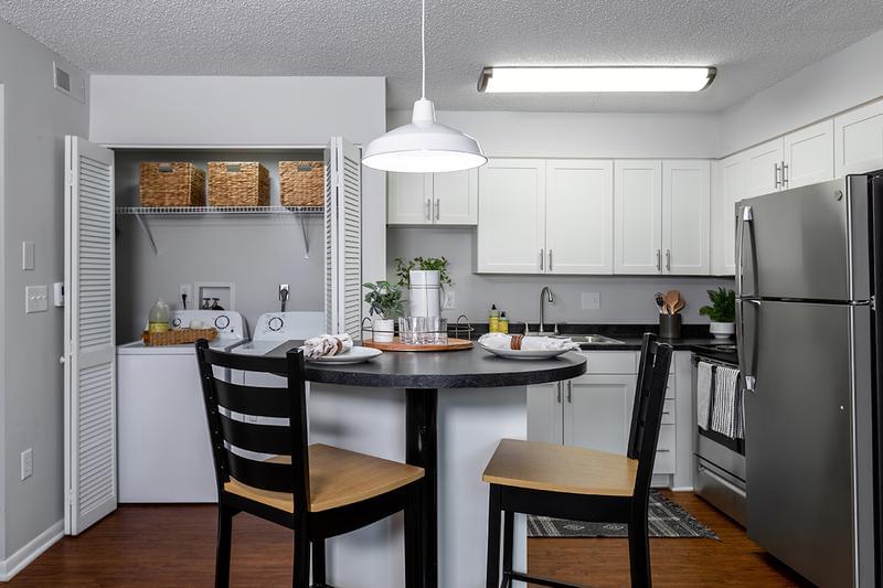 Eat In Kitchens | Select floor plans feature eat-in kitchens with barstool seating.