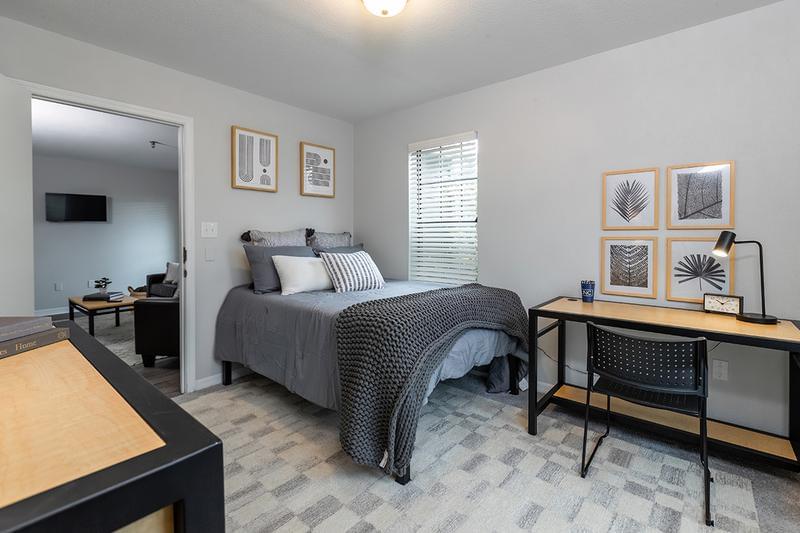 Bedroom | Bedrooms feature plush carpeting and wood-style blinds.