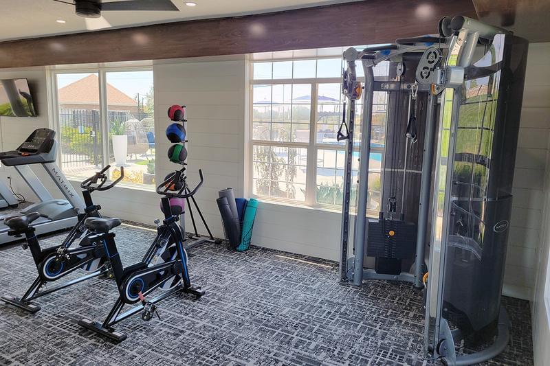 Spinning Bikes & Weight Training | Our fitness center also features spinning bikes and eight training equipment, so you can get a full body workout.