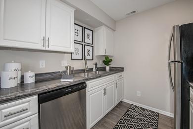 Stainless Steel Appliances | Kitchens feature beautiful stainless-steel appliances, including a refrigerator, stove, microwave, and a dishwasher. 