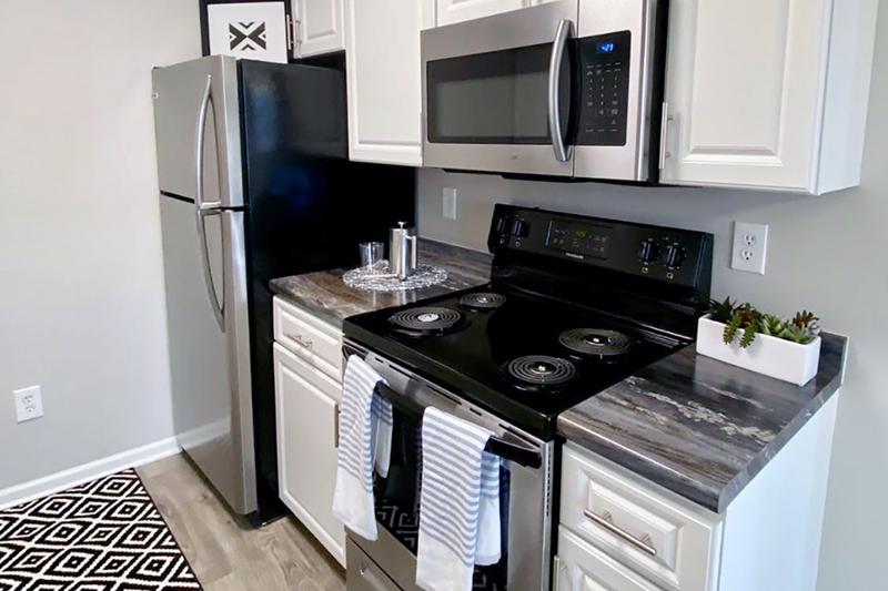 Stainless Steel Appliances | Kitchens feature beautiful stainless steel appliances, including a refrigerator, stove, microwave, and a dishwasher 