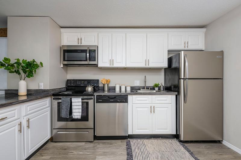 Stainless Steel Appliances | Updated kitchens featuring stainless steel appliances and a breakfast bar.
