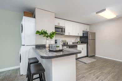 4 Bed 2 Bath Kitchen | Our spacious kitchen comes fully applianced in stainless steel and offers ample cabinet space. 