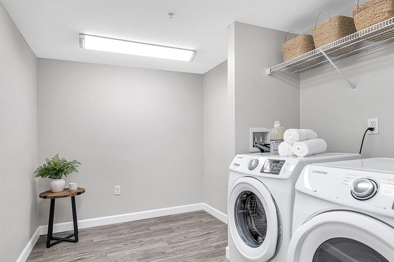 4 Bed 4 Bath Laundry Room | The laundry room is equipped with full-size washer and dryer appliances, and also offers plenty of additional storage space.