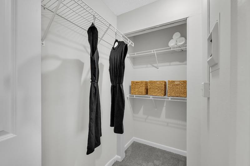 Walk-In Closets | Spacious walk-in closets with built-in shelving.